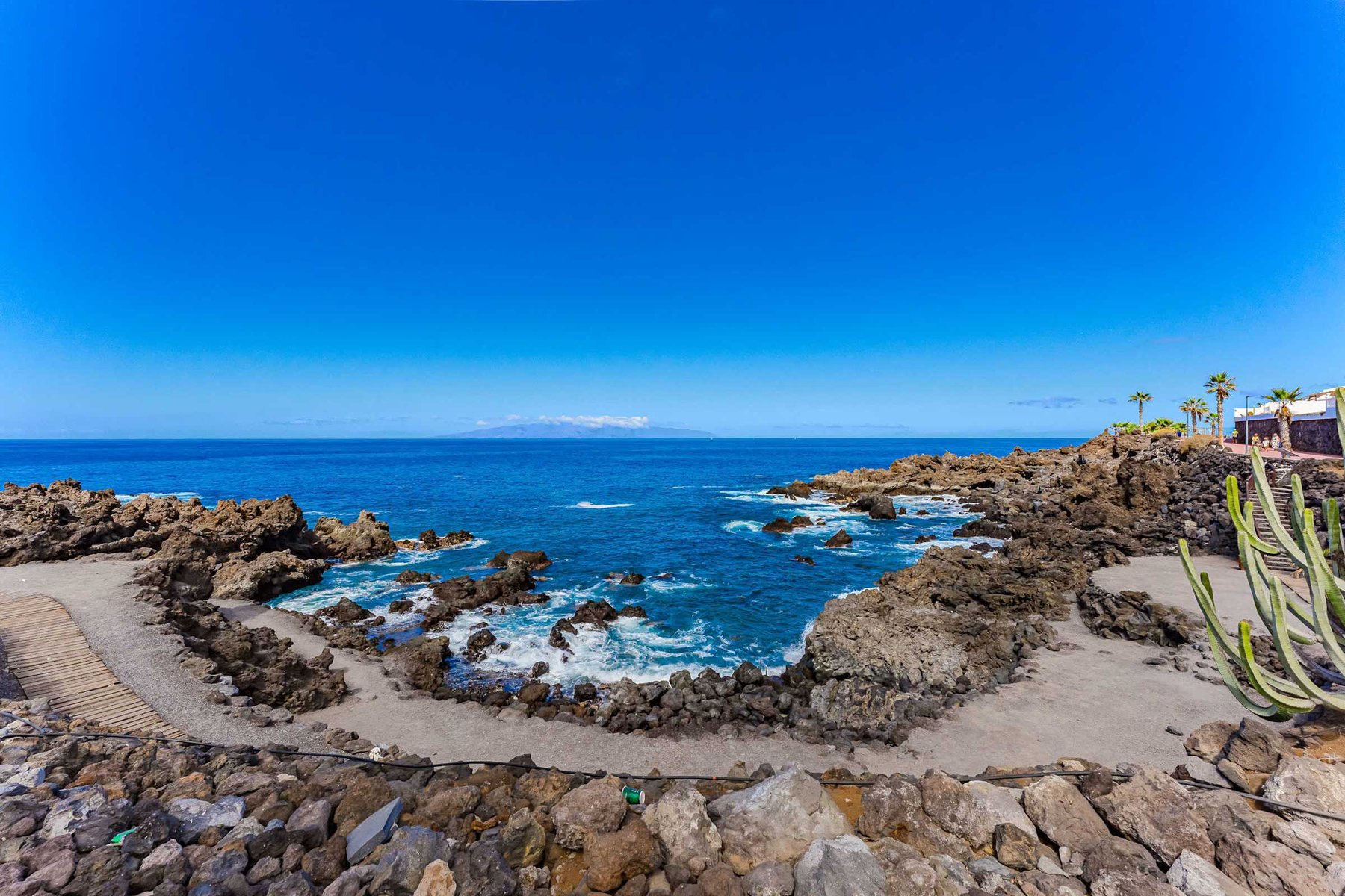 Dramatic Coastal Vista – Bask in Panoramic Ocean Views Framed by Rugged Volcanic Rock