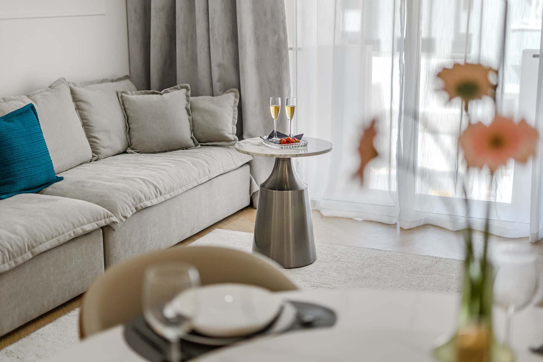 Champagne Moment – Lounge Seating with Afternoon Light and a Toast to Coastal Living