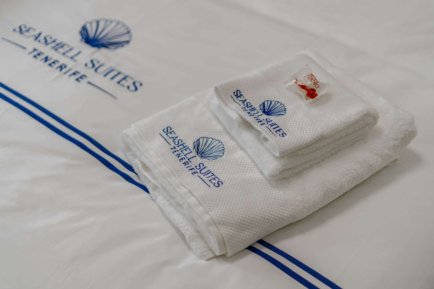 Crisp White Linens – Branded Towels and Soft Bedding Deliver Boutique Comfort and Five-Star Cleanliness