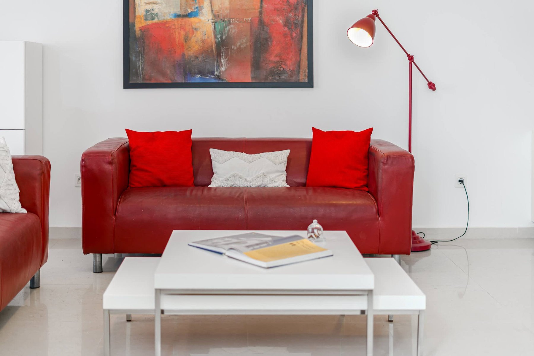 Modern Living Area with Sofas, Bold Art & Comfy Touches – A Bright Social Space to Unwind