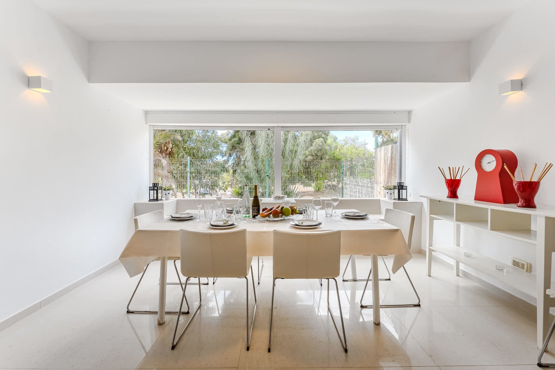 Bright Dining Area with Floor-to-Ceiling Windows – Garden Views, Contemporary Decor, and Table Set for Shared Moments