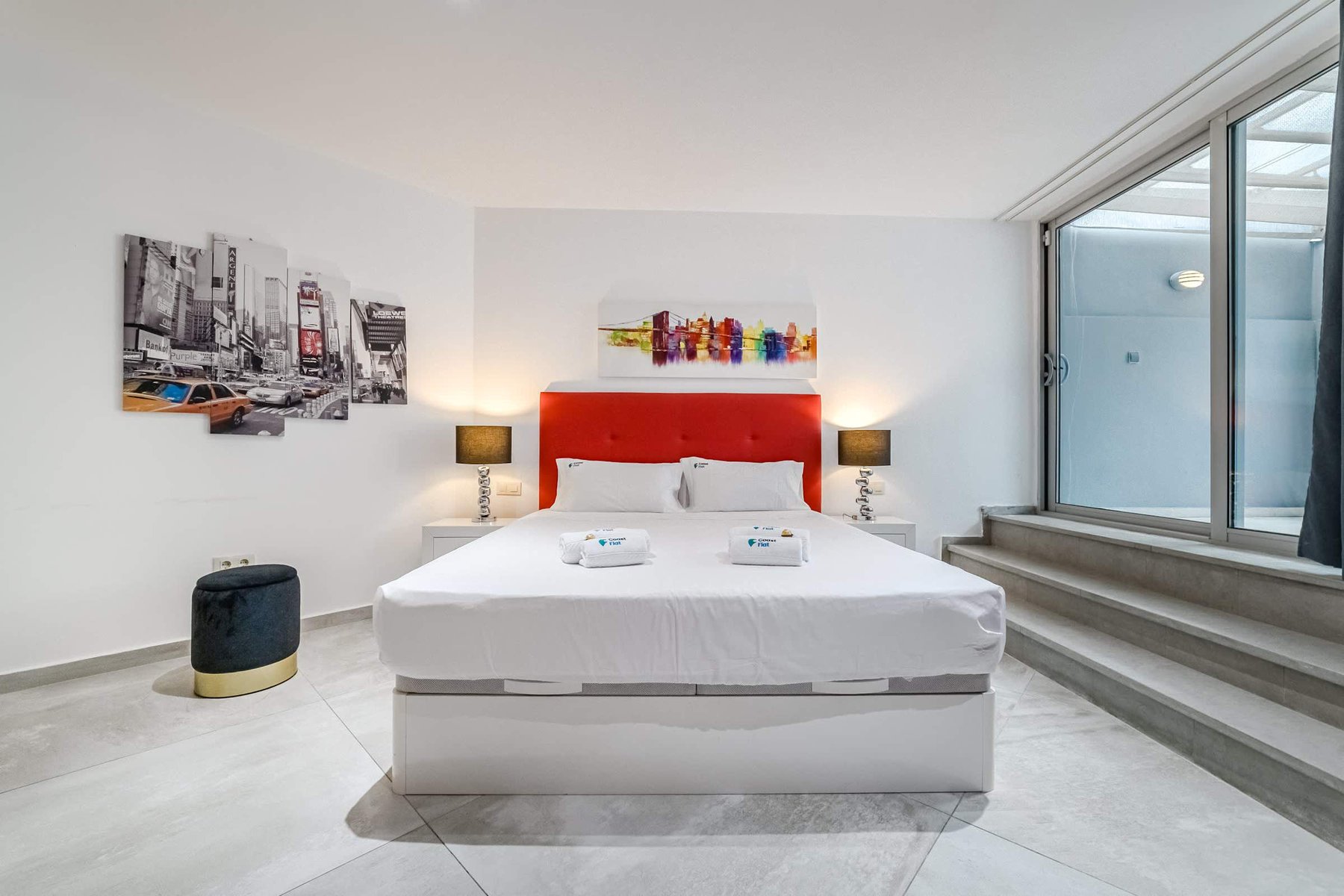 Contemporary King Bedroom with Artistic Accents - Relax in Style with a Bold Headboard & Cityscape Decor