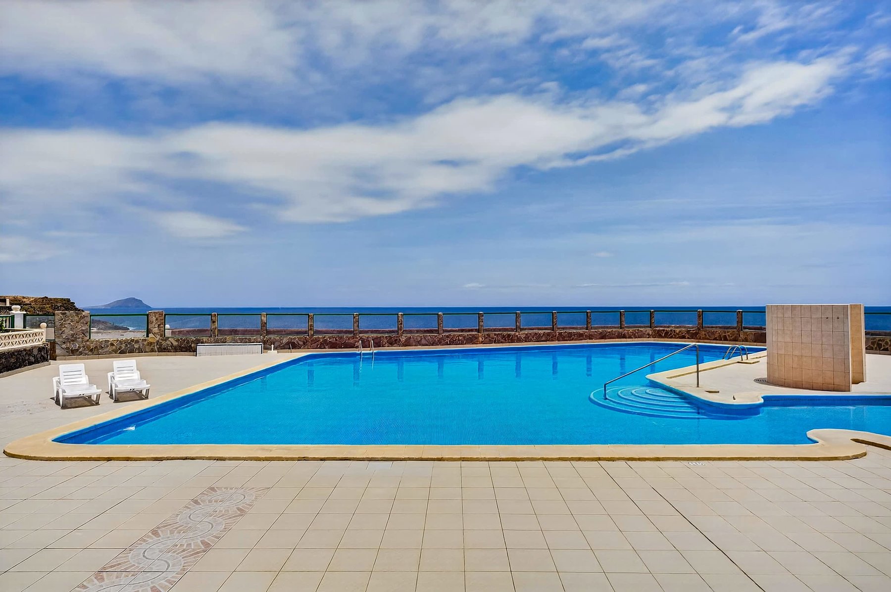 Year-Round Pool Area with Ocean Views & Sunbeds 