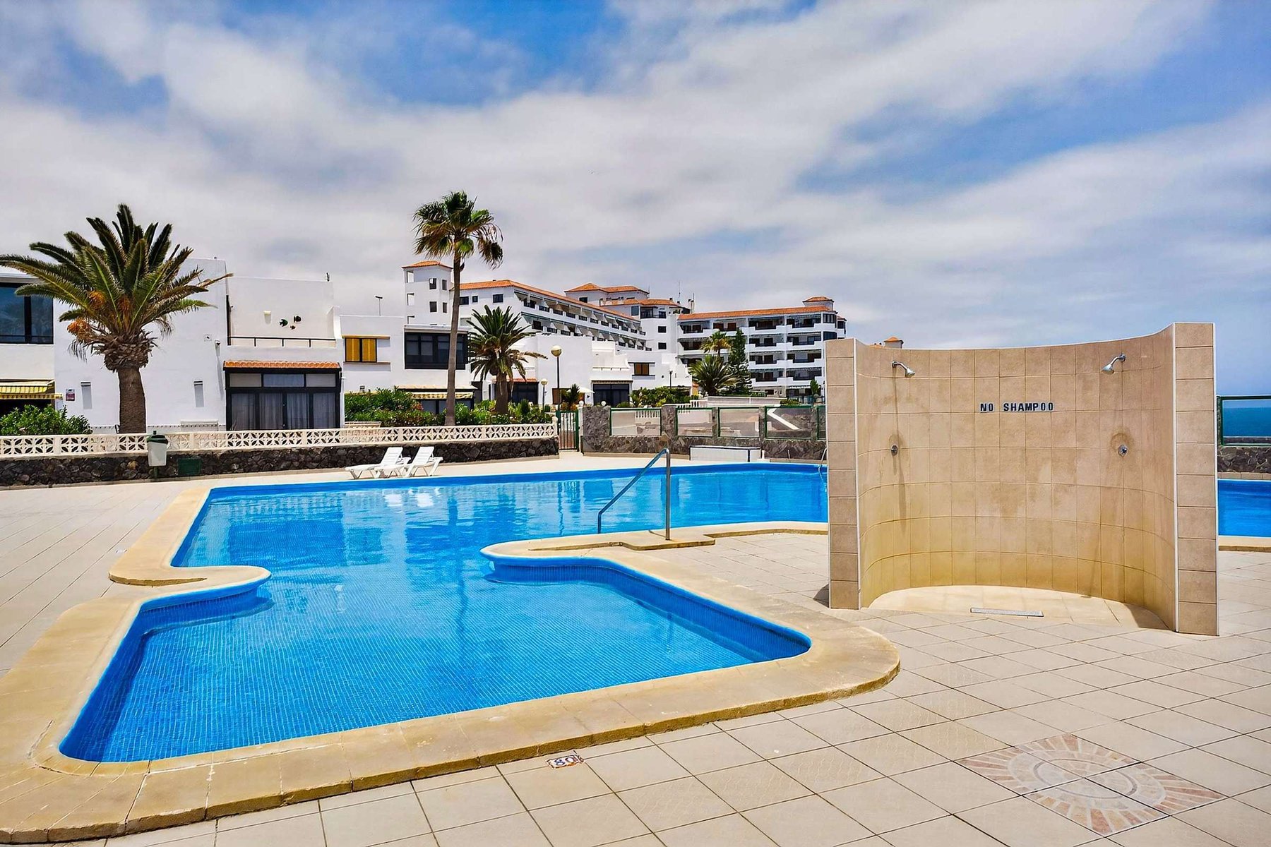 Year-Round Pool Area with Ocean Views & Sunbeds 