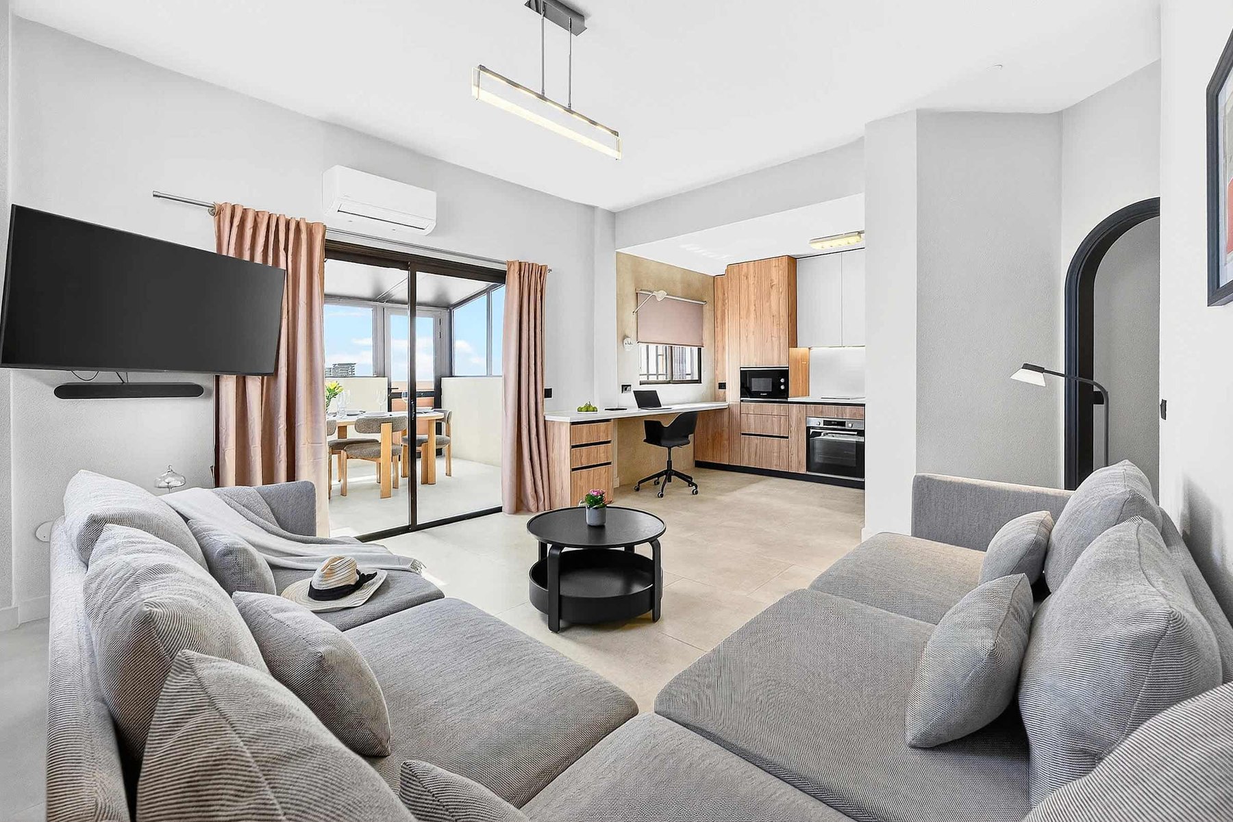 Spacious Living Area with Ocean View, AC, Multimedia TV & Sonos Sound System, Dedicated Working Space & Direct Exit to the Private Roof-Top Terrace