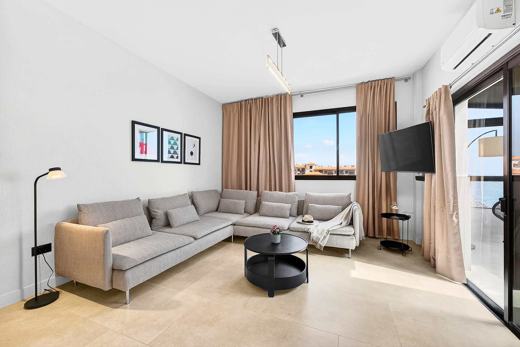 Sitting & Sleeping in a Spacious Living Area with Ocean View, AC, Multimedia TV & Sonos Sound System, Dedicated Working Space & Direct Exit to the Private Roof-Top Terrace