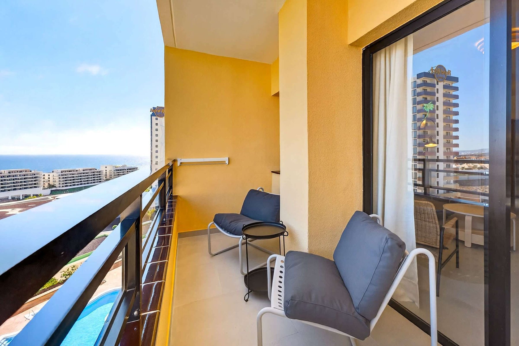 Private Balcony with Atlantic Ocean & Pool Views, Outdoor Seating & Sunset Atmosphere