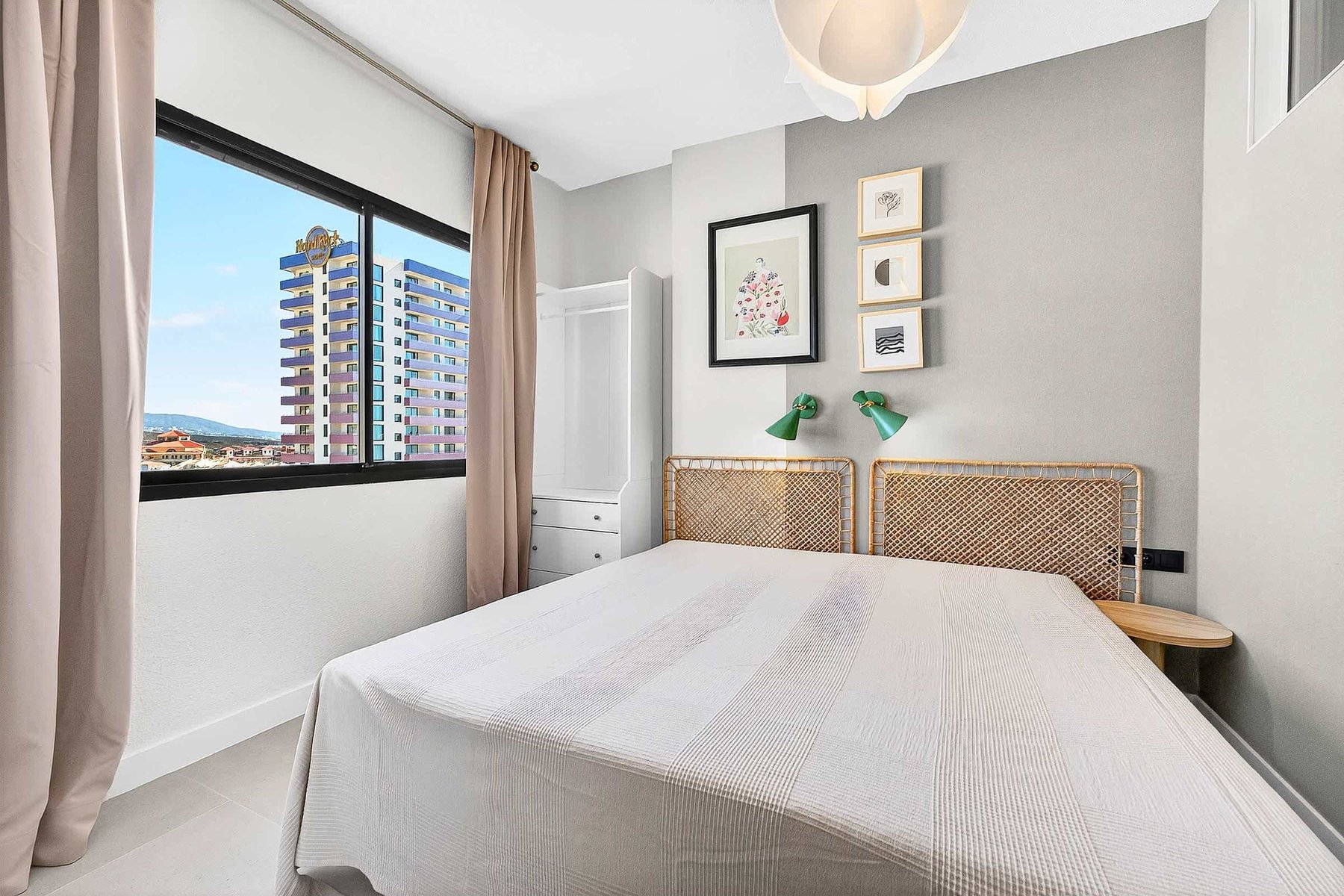 Stylish Bedroom with Rattan Headboard & Views