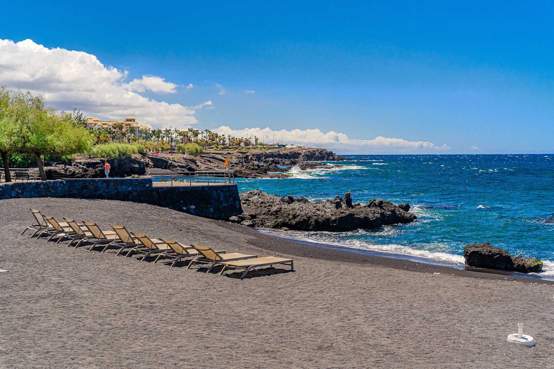 Black-Sand Beach with Loungers - a Quiet Volcanic Beach with Gentle Waves