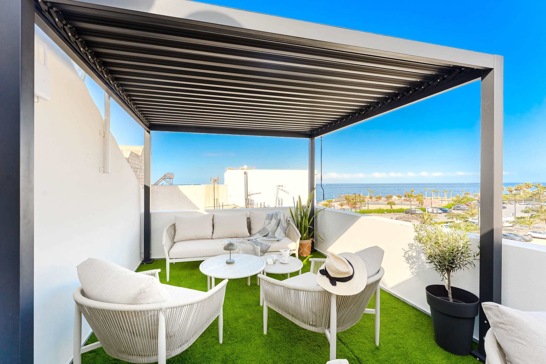 Shared Outdoor Lounge Space with Ocean Breeze and Modern Comfort