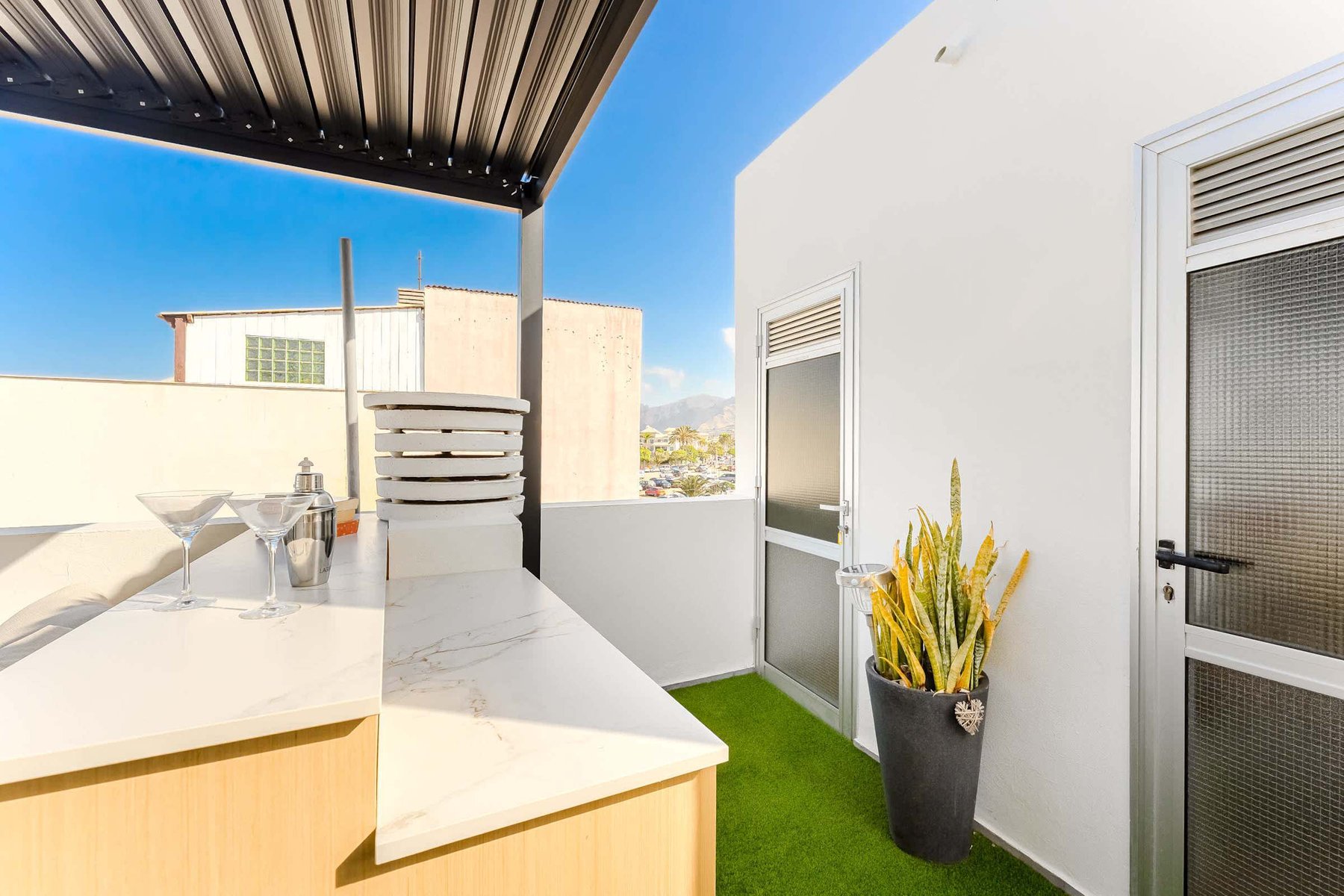 Shared Outdoor Lounge Space with Ocean Breeze and Modern Comfort