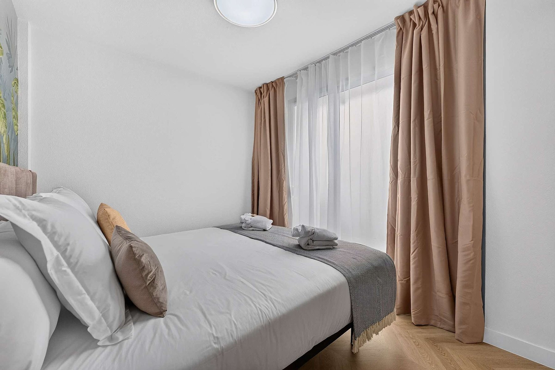 Serene Boutique Bedroom with Sophisticated Island-Inspired Interiors