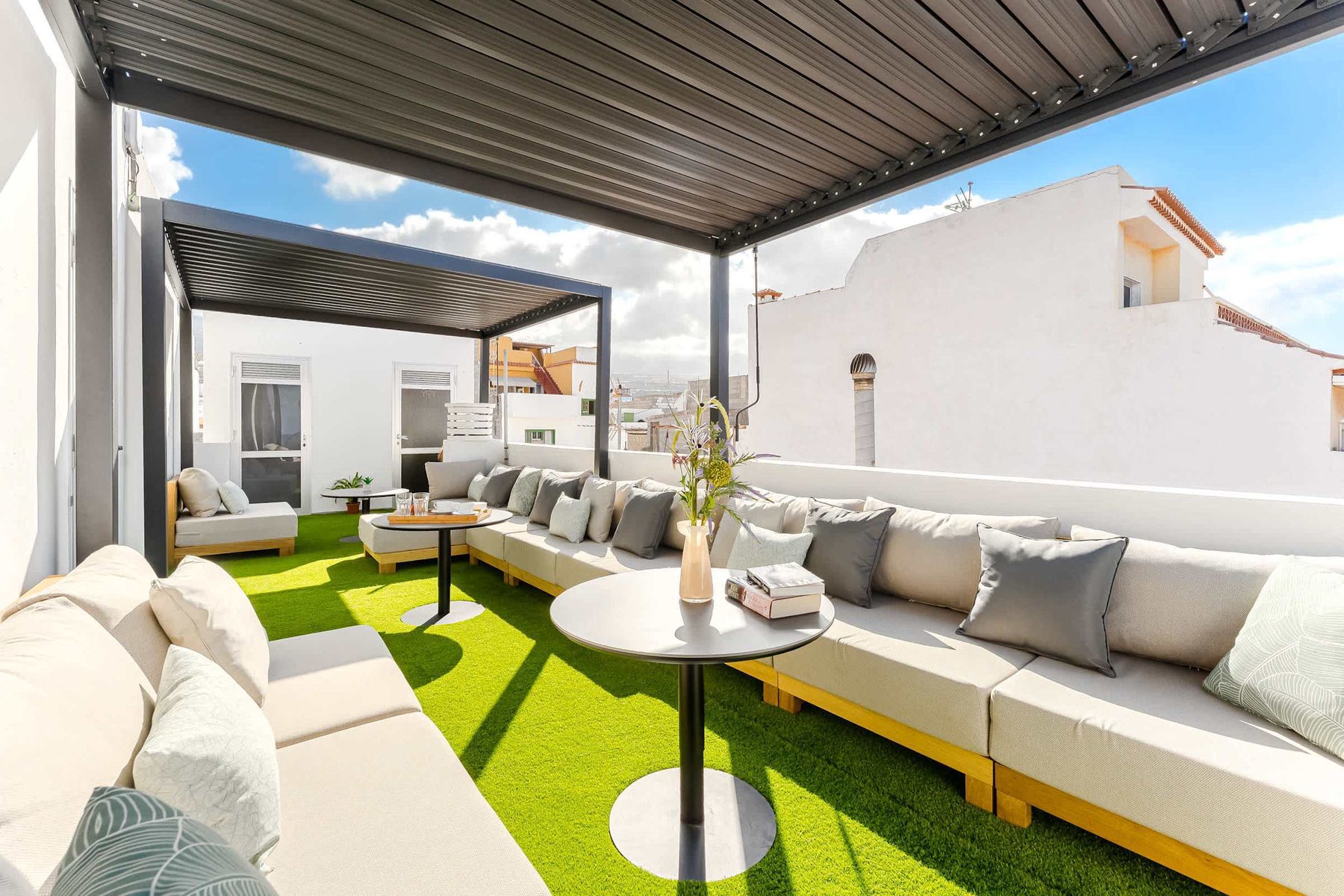 Shared Outdoor Lounge Space with Ocean Breeze and Modern Comfort