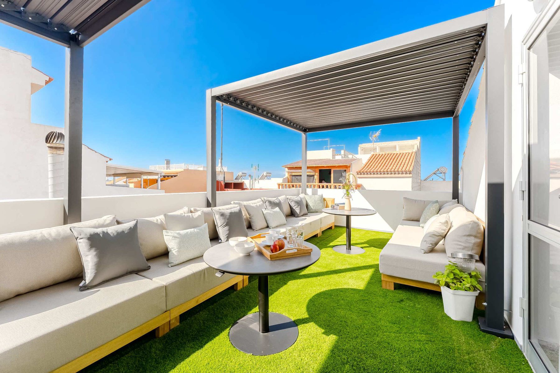 Shared Outdoor Lounge Space with Ocean Breeze and Modern Comfort