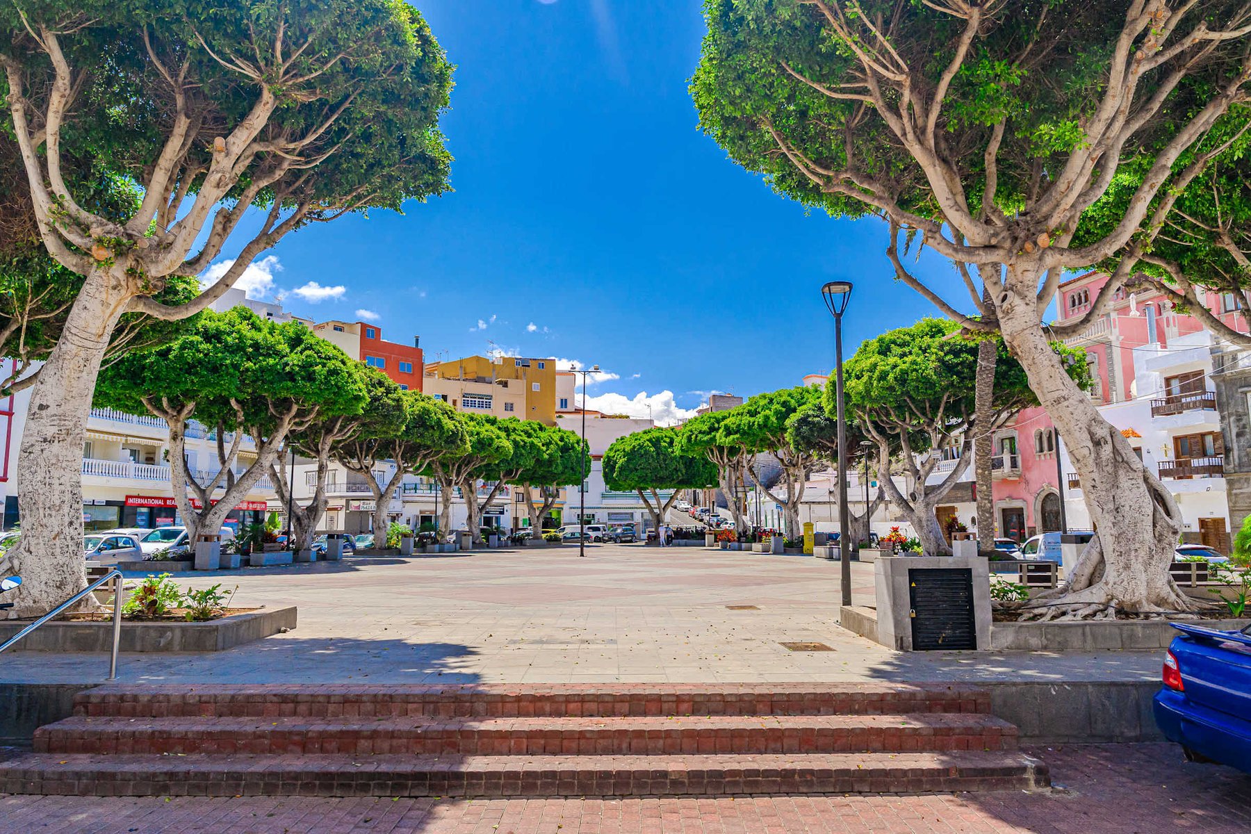 Charming Village Square shaded by trees - ideal for Coffee, People-Watching, or a Peaceful Stroll