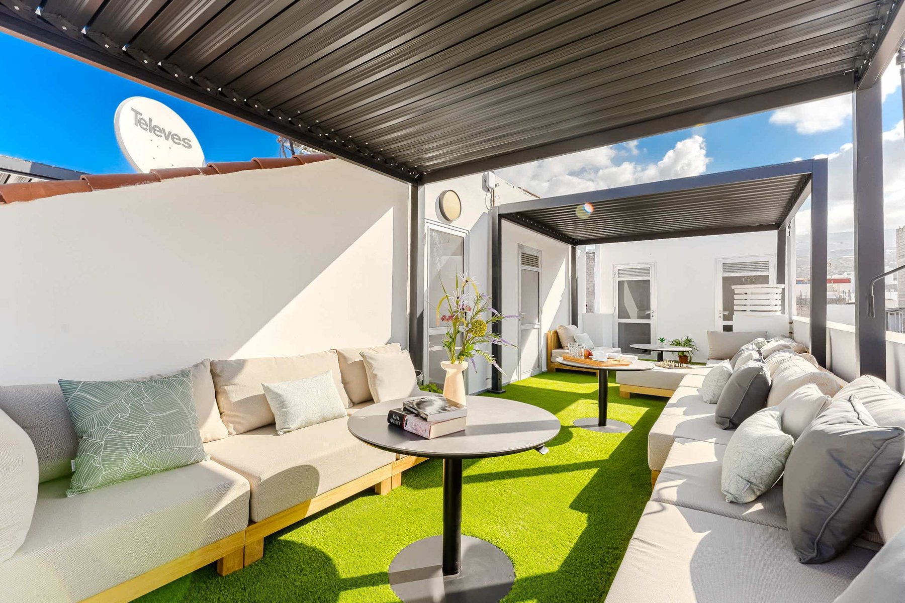 Shared Outdoor Lounge Space with Ocean Breeze and Modern Comfort