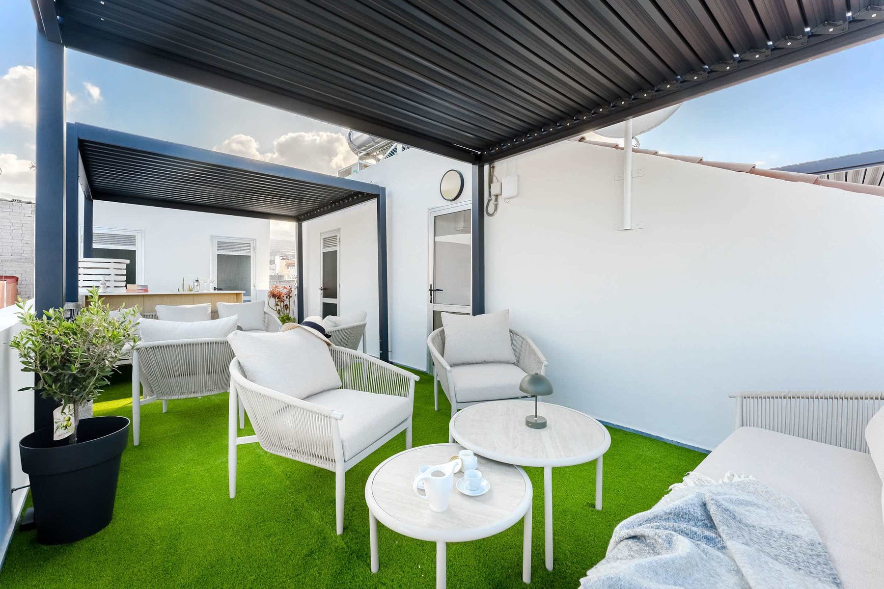 Shared Outdoor Lounge Space with Ocean Breeze and Modern Comfort