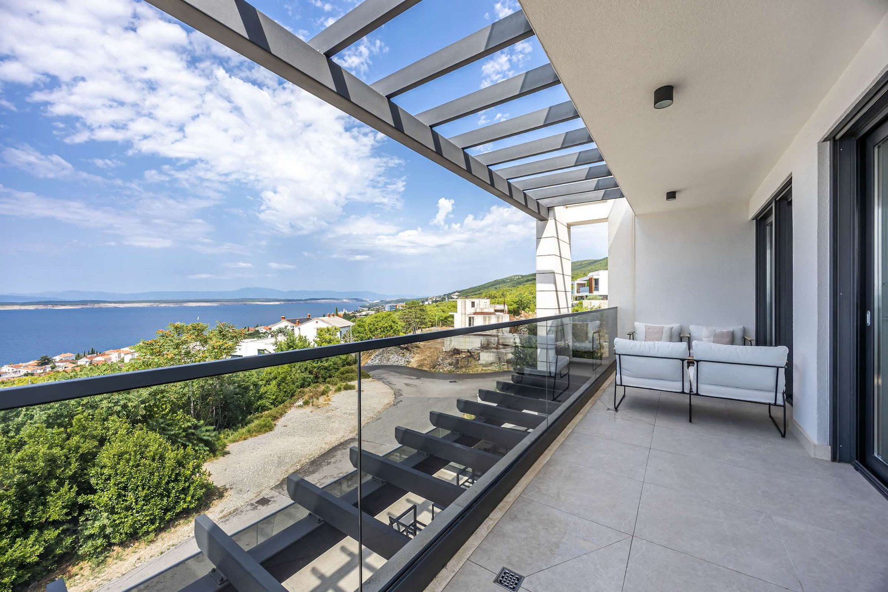Living-room terrace: covered seating with sea view