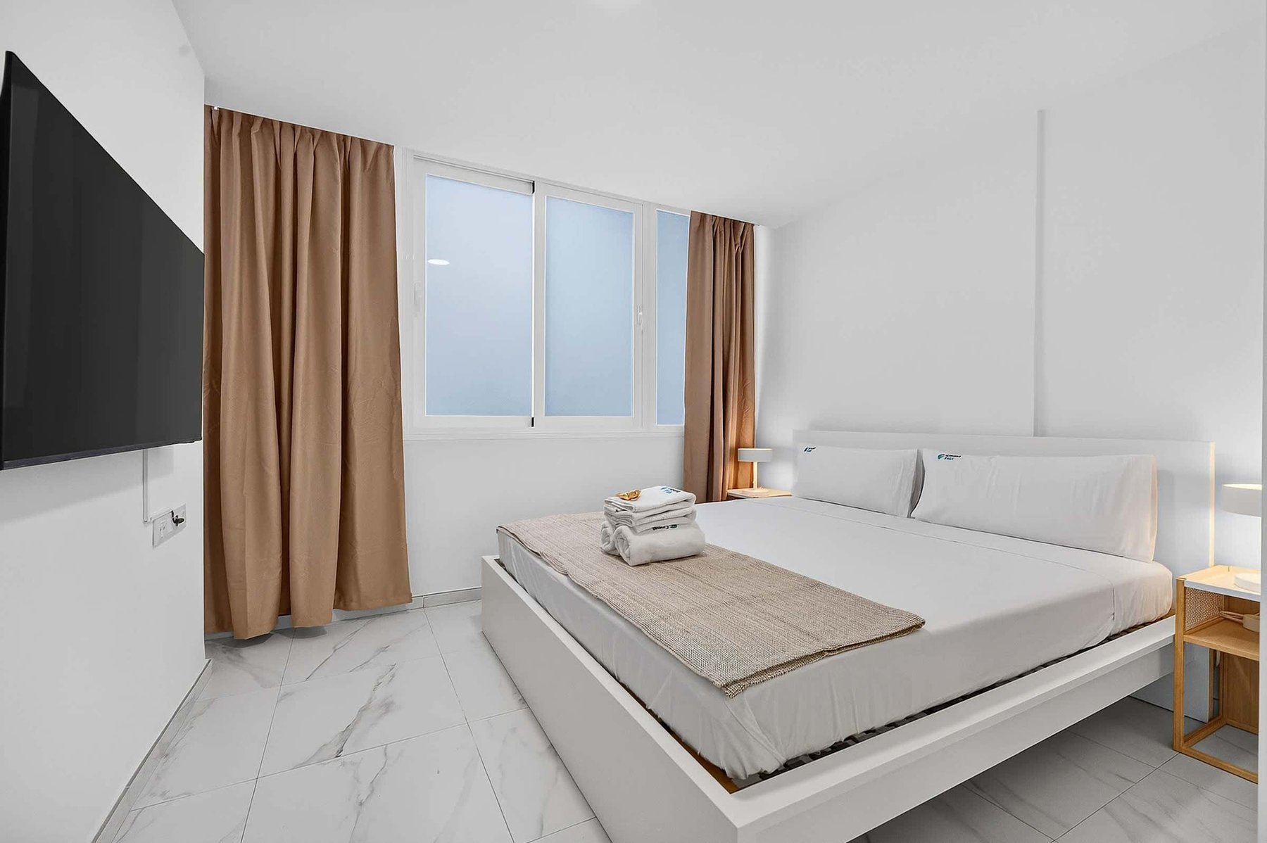 Bedroom with Smart TV & Blackout Curtains