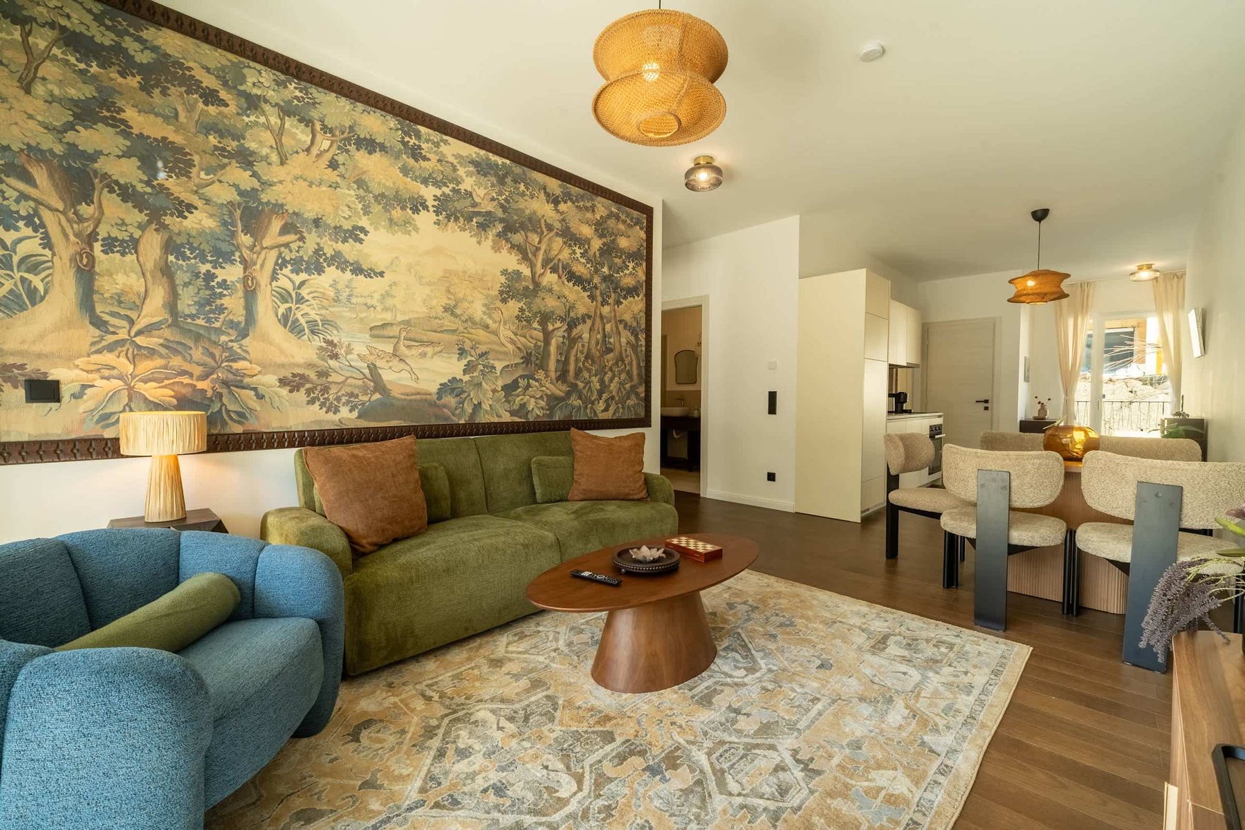 Living room with sofa bed and tapestry wall