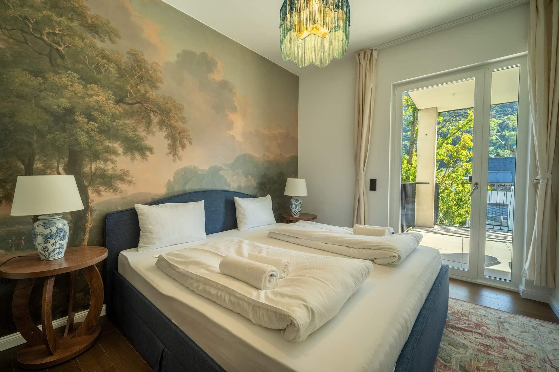 Bedroom 2 with doors to the balcony