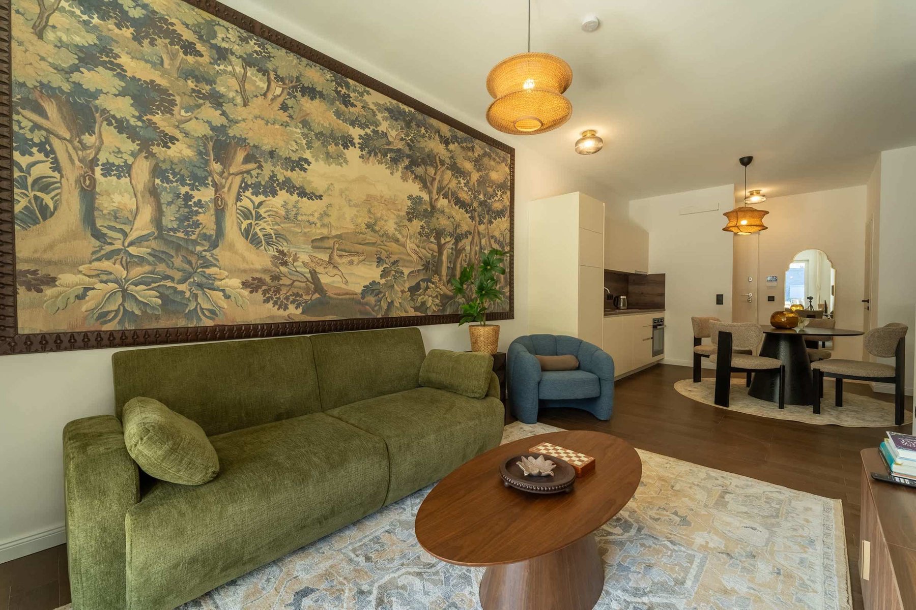 Living room with sofa bed and tapestry wall