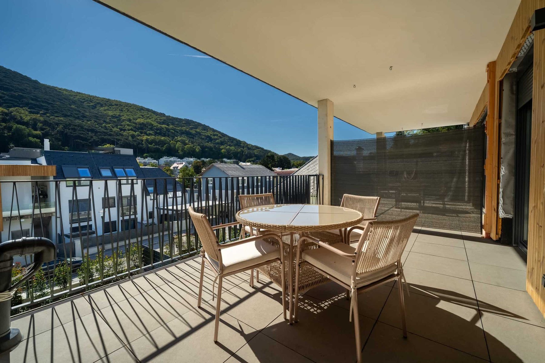 Balcony dining table with hill views