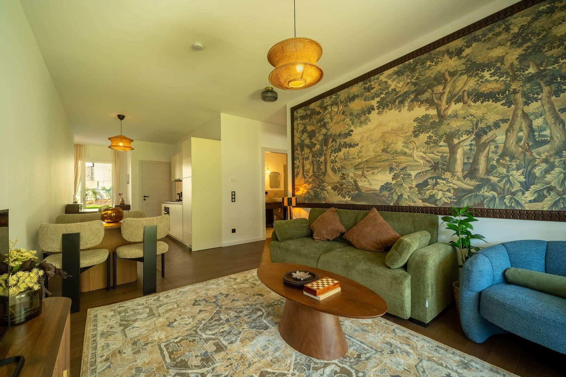 Living room with sofa bed and tapestry wall