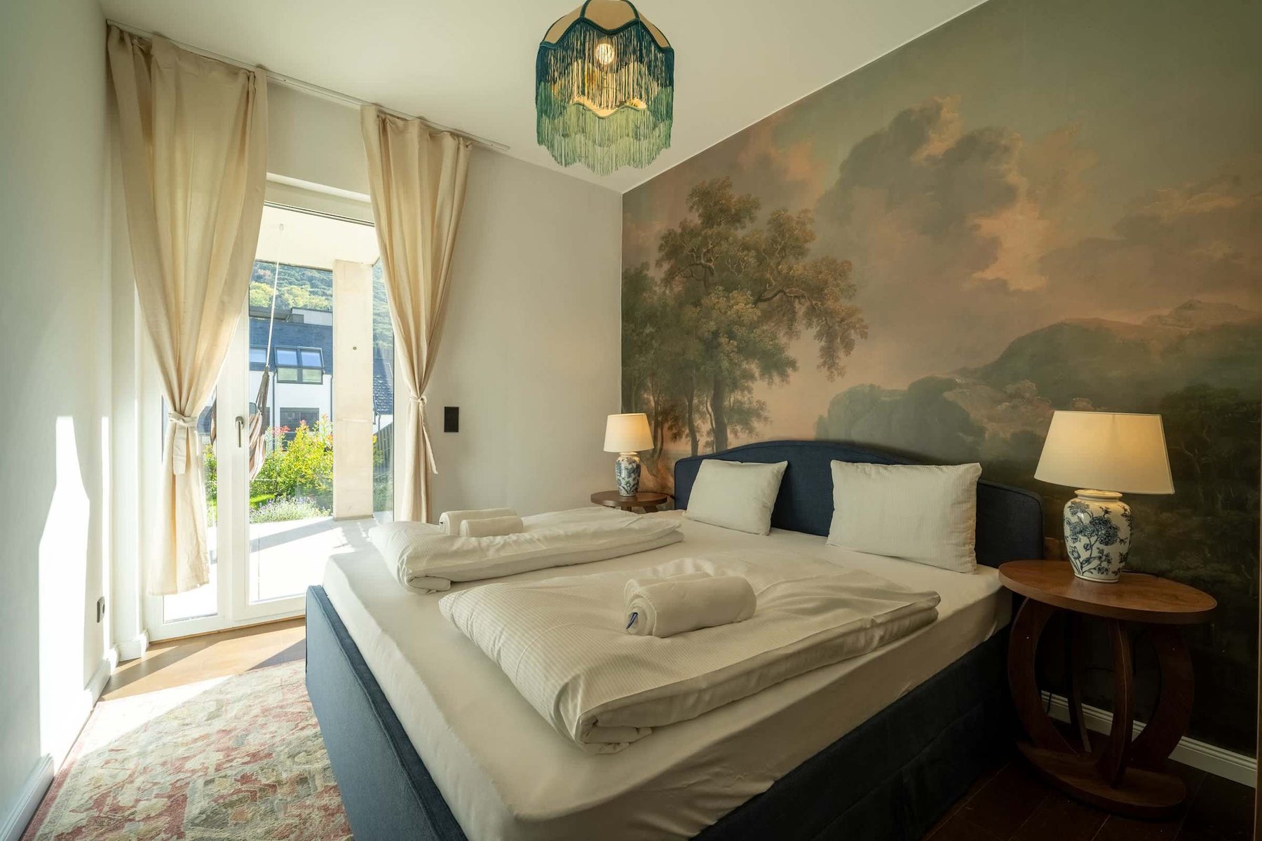 Bedroom 1 with doors to the terrace