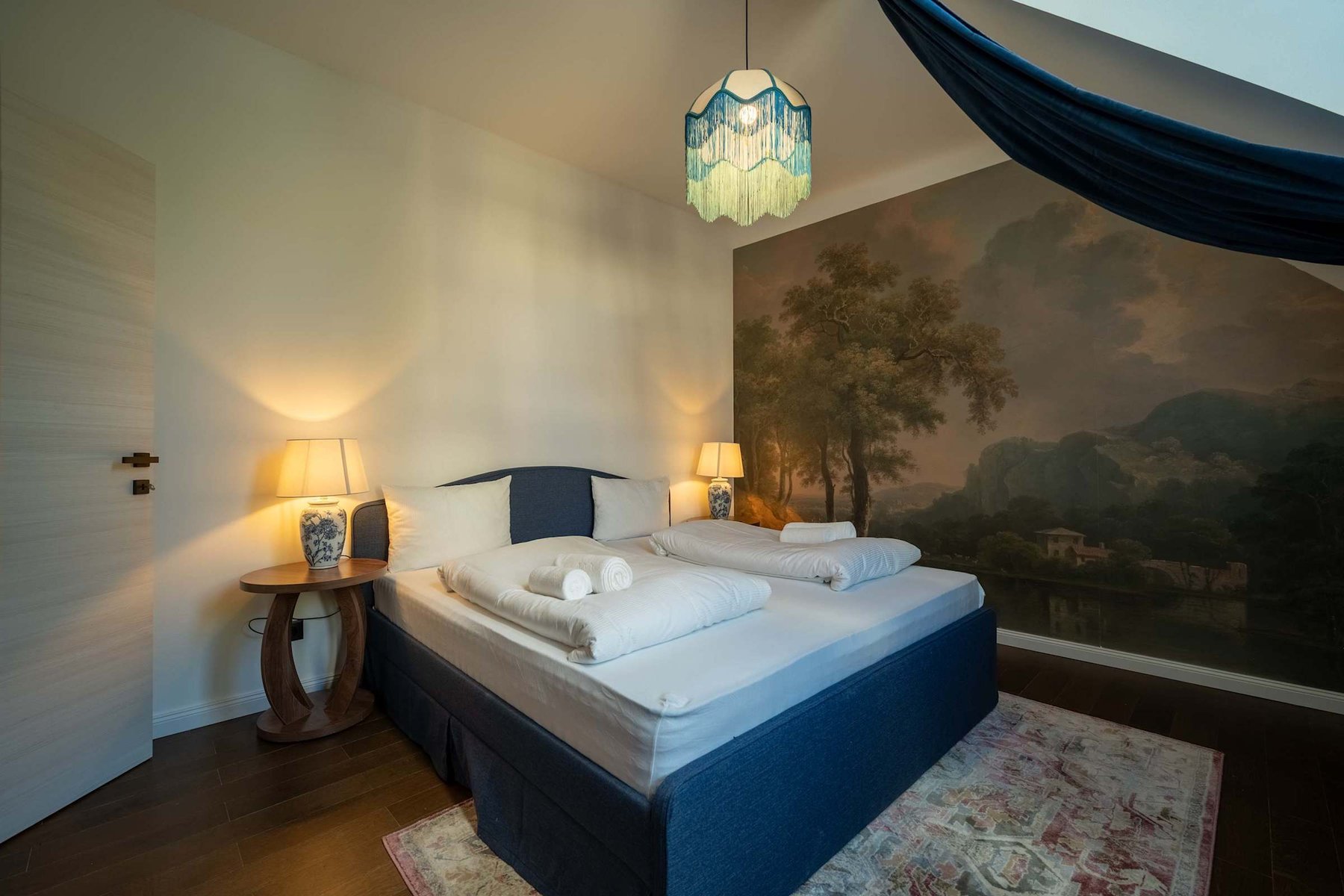 Bedroom 1 with landscape mural