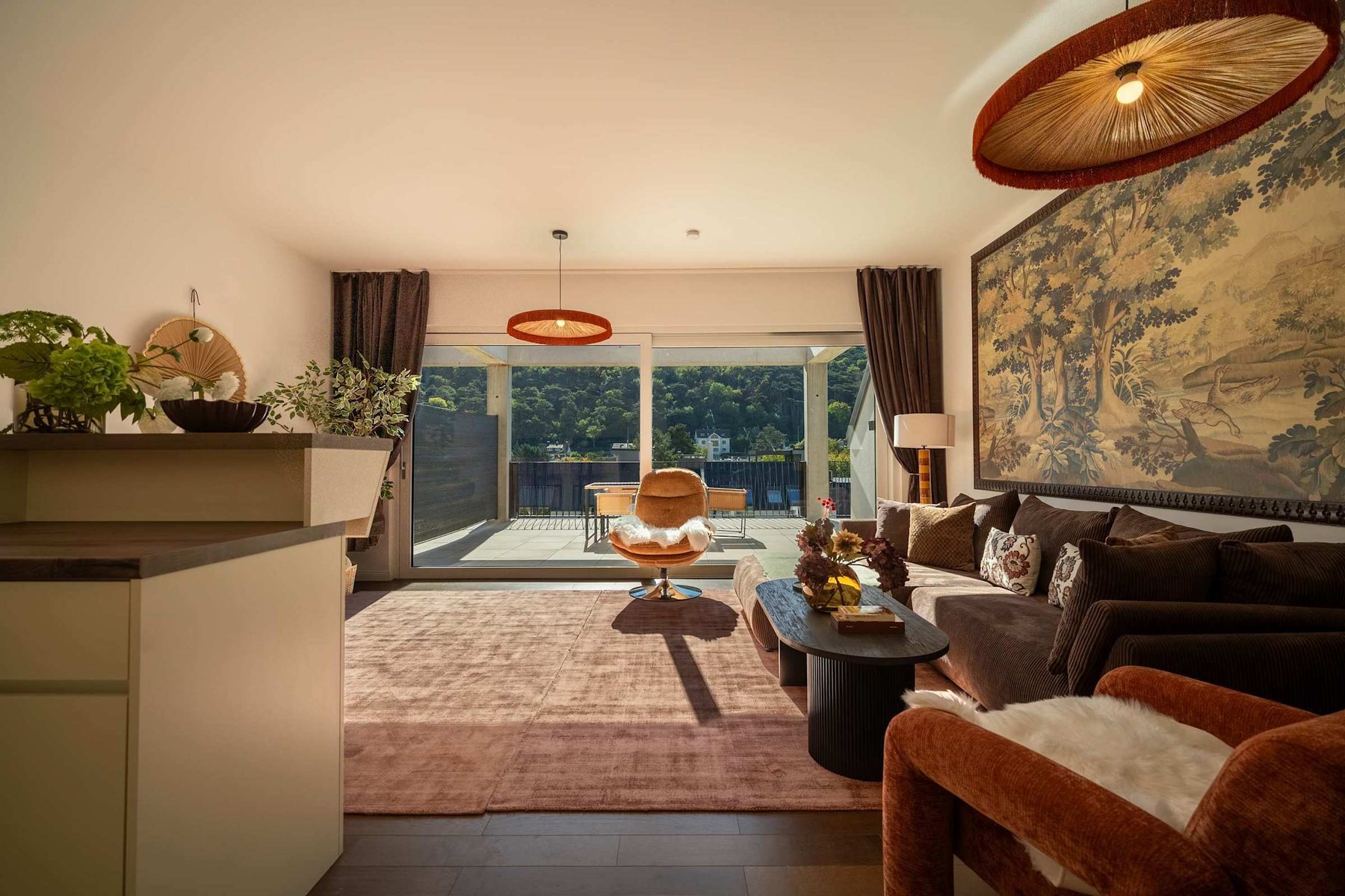 Bright living room with floor-to-ceiling windows onto the terrace